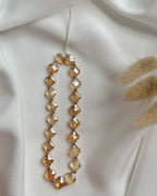 Handykette aus goldenem Clover