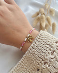 Perlenarmband in Weiß und Rosa & Schleifen-Anhänger