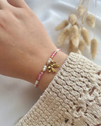 Perlenarmband in Weiß und Rosa & Schleifen-Anhänger