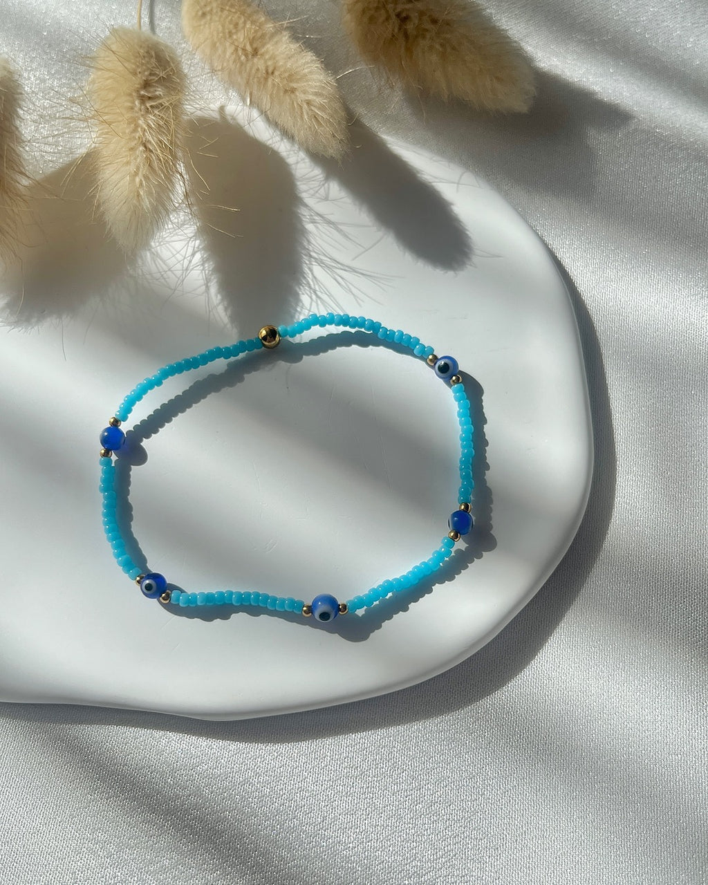 Perlenarmband mit blauen Miyuki-Perlen & Nazar