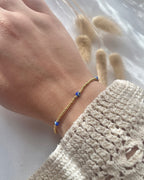 Perlenarmband aus goldenen Miyuki-Perlen & Nazar