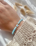 Perlenarmband aus blauen Perlen & Nazar