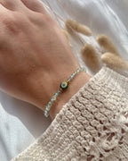 Perlenarmband aus grünen Perlen & Nazar