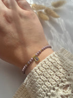 Perlenarmband aus lilanen Kristallperlen & Diamanten-Anhänger