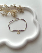 Armband in Lila & Weiß mit Auge-Charm