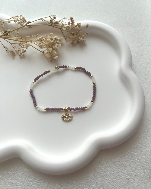 Armband in Lila & Weiß mit Auge-Charm