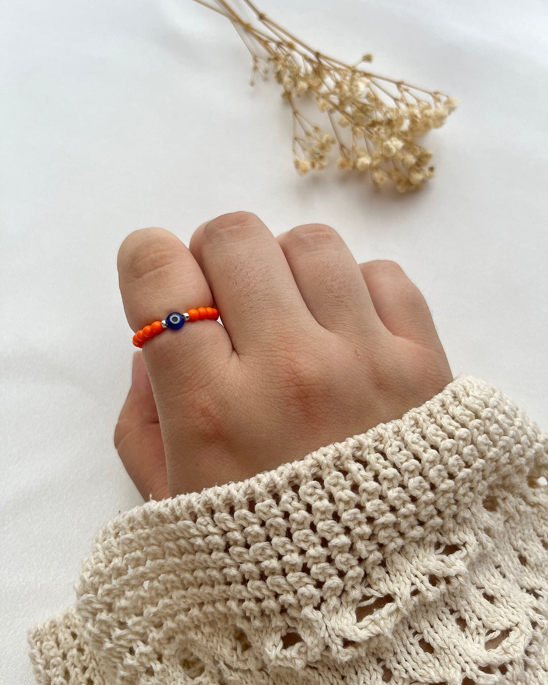 Perlenring in Orange & Nazarperle mit Silberdetails