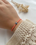 Perlenarmband in Koralle & einer Nazarperle