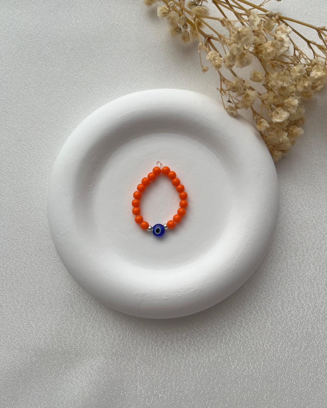 Perlenring in Orange & Nazarperle mit Silberdetails