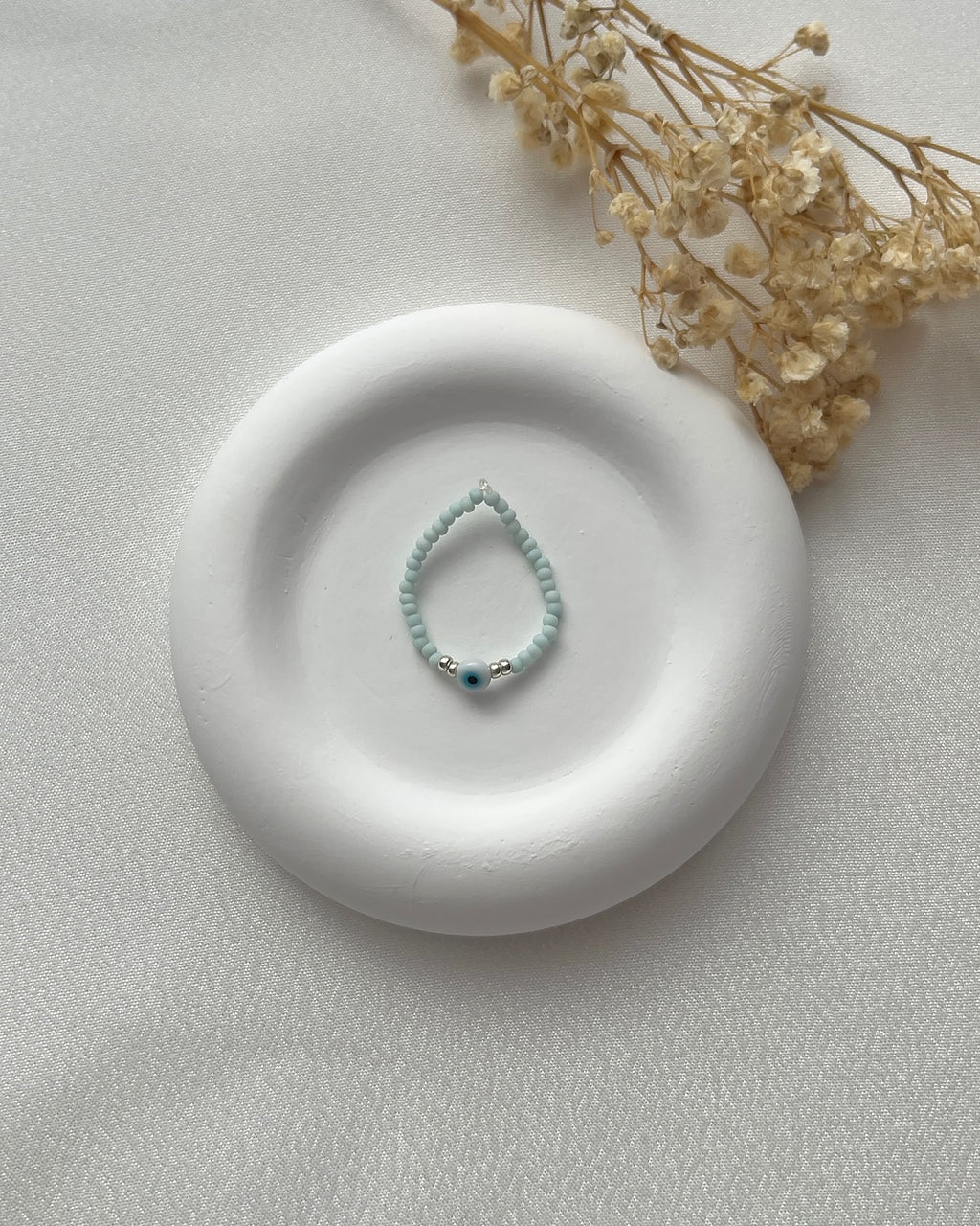 Perlenring in Mintgrün & Nazarperle mit Silberdetails