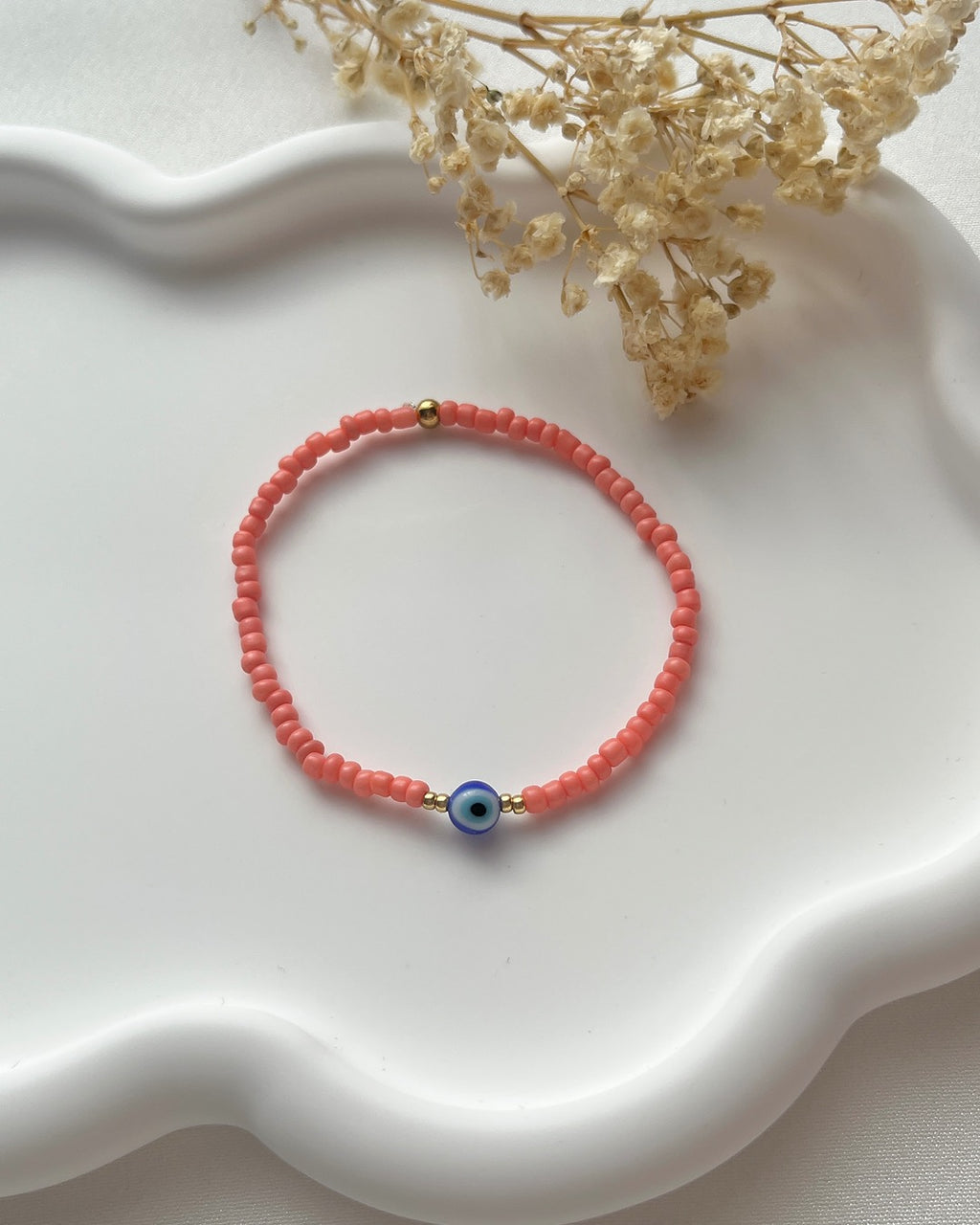 Perlenarmband in Koralle & einer Nazarperle