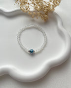 Perlenarmband in durchsichtig Weiß & Nazarkugel