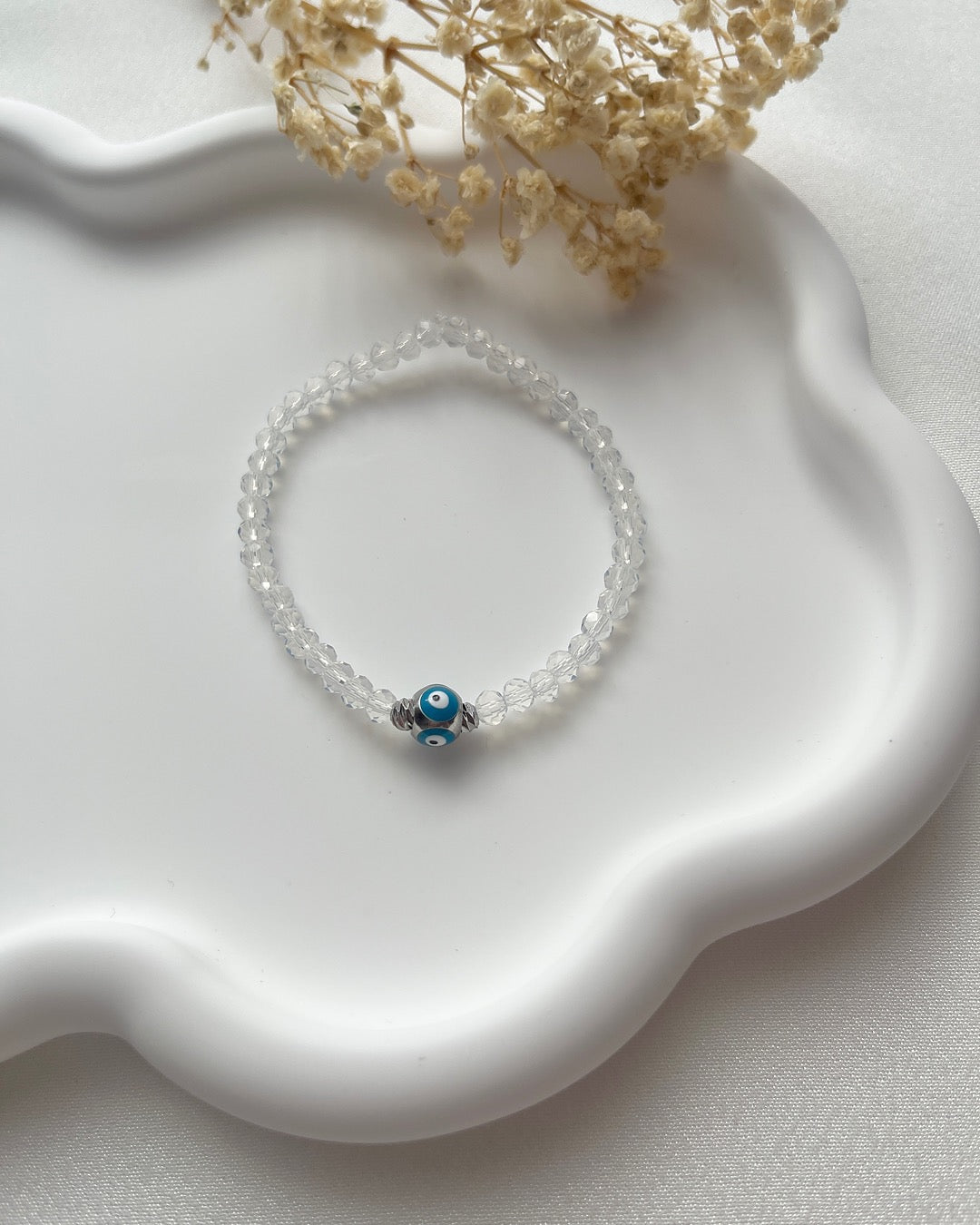 Perlenarmband in durchsichtig Weiß & Nazarkugel